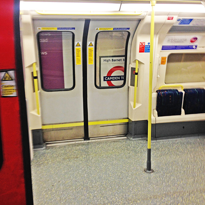 London Underground carriage doors with a route sign reading High Barnet and Camden Town